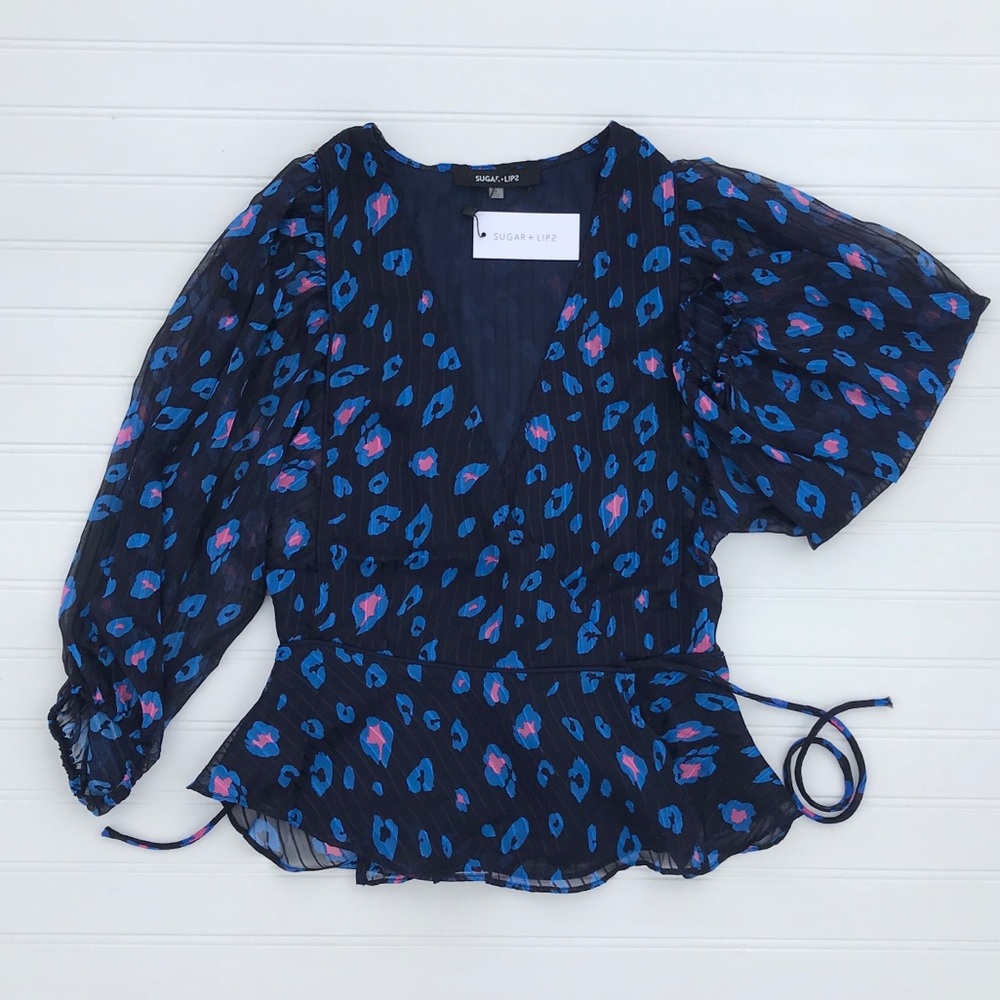 Leopard print balloon sleeve blouse.